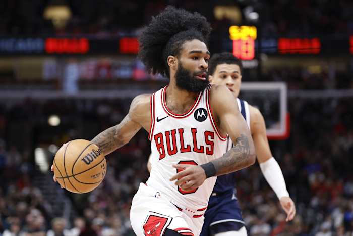 Chicago Bulls guard Coby White (0) drives to the basket against the Dallas Mavericks 